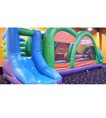 Colorful Ninja inspired obstacle course with slide.