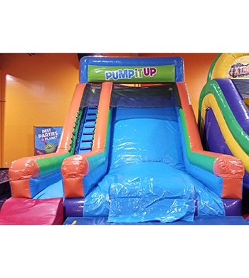 Inflatable slide with stairs on one side to climb to the top and slide down.
