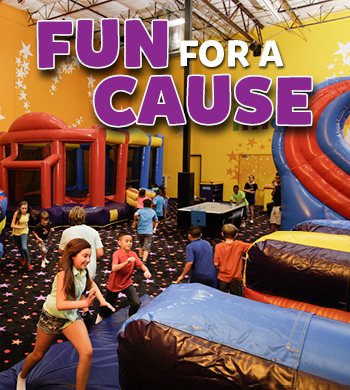 Young Kids Play in Inflatable jump houses for a good cause