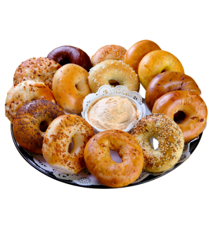 several bagels on a platter with cream cheese