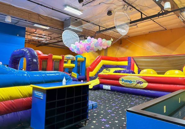 Pump It Up San Jose CA kids birthday party place filled with inflatable attractions and balloon drop for private birthday parties.
