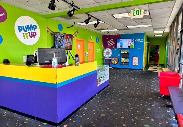Pump It Up Union City CA kids birthday party place lobby with desk, check in area and video safety area.