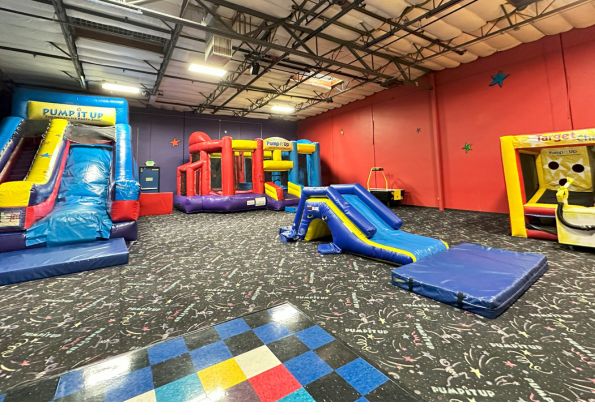 Pump It Up Oakland CA kids private birthday party place filled with indoor playground with inflatable attractions.