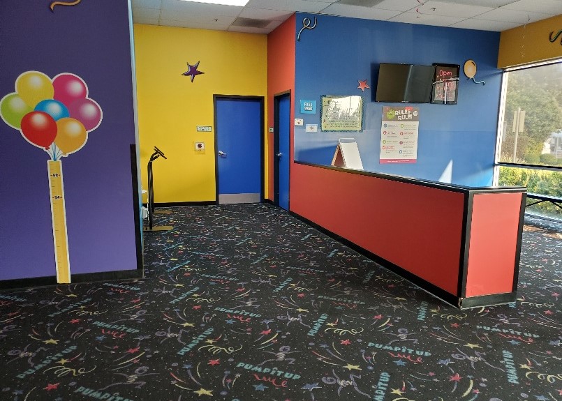 Lobby of Pump It Up Oakland California, at a kids inflatable birthday party venue.